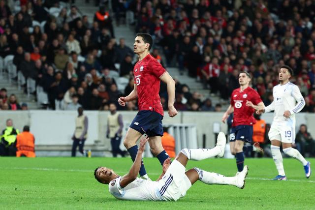 Aston Villa's English striker #11 Ollie Watkins eyes the ball from the ground after scoring his team's first goal during the UEFA Europa League round of 16 first leg football match between Lille (LOSC) and Aston Villa  at the Pierre-Mauroy Stadium in Villeneuve-d'Ascq, northern France, on March 12, 2026. (Photo by Sameer AL-DOUMY / AFP)
