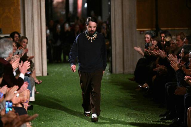 Valentino's Creative Designer Alessandro Michele greets the audience at the end of the show "Interferenze" Fall/Winter 2026-2027 collection of Italian fashion house Valentino at Palazzo Barberini in Rome on March 12, 2026. Italian fashion house Valentino returns to its roots with a catwalk show designed by creative director Alessandro Michele in one of Rome's most spectacular venues, two months after the death of founder Valentino Garavani. (Photo by Alberto PIZZOLI / AFP)