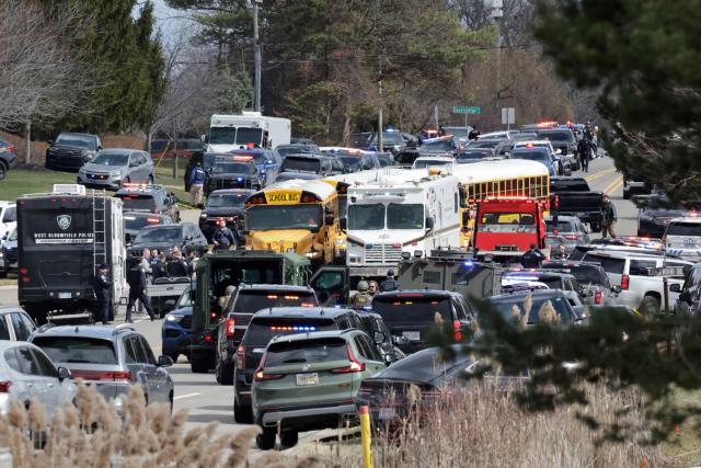 Law enforcement responds at the scene of a shooting on Walnut Lake Rd, outside of Temple Israel synagogue, in West Bloomfield, Michigan, a suburb of Detroit, on March 12, 2026. An unidentified shooter was killed on March 12 after exchanging gunfire with security in an attack on a synagogue in the outskirts of Detroit, Michigan, police said. Police said the gunman was dead following the attack on the Temple Israel synagogue in West Bloomfield. (Photo by JEFF KOWALSKY / AFP)