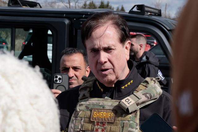 Oakland County Sheriff Michael Bouchard talks to the media down the street from the scene of a shooting at Temple Israel synagogue, in West Bloomfield, Michigan, a suburb of Detroit, on March 12, 2026. An unidentified shooter was killed on March 12 after exchanging gunfire with security in an attack on a synagogue in the outskirts of Detroit, Michigan, police said. Police said the gunman was dead following the attack on the Temple Israel synagogue in West Bloomfield. (Photo by JEFF KOWALSKY / AFP)