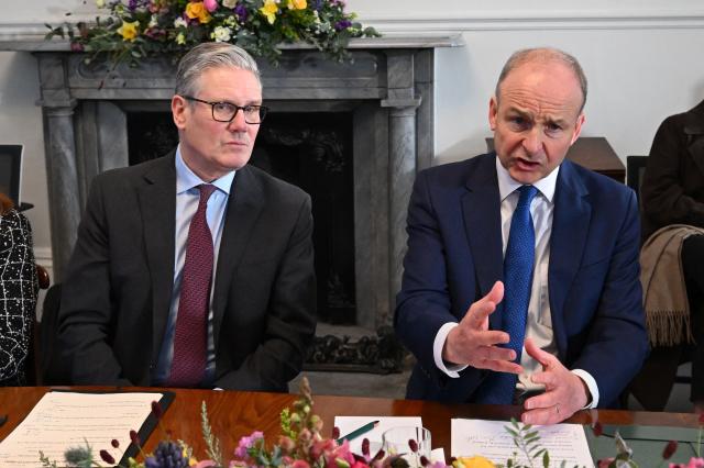 Britain's Prime Minister Keir Starmer and Prime Minister Micheal Martin attend a business roundtable and youth engagement during his visit to Cork, Ireland, on March 12, 2026, ahead of a two-day UK-Ireland summit. (Photo by Charles McQuillan / POOL / AFP)