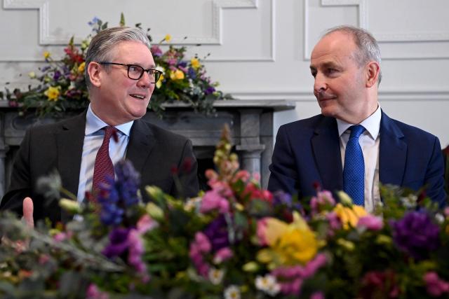 Britain's Prime Minister Keir Starmer and Prime Minister Micheal Martin attend a business roundtable and youth engagement during his visit to Cork, Ireland, on March 12, 2026, ahead of a two-day UK-Ireland summit. (Photo by Charles McQuillan / POOL / AFP)