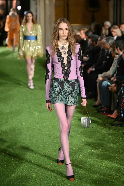 A model presents a creation by Italian fashion house Valentino during the show "Interferenze" Fall/Winter 2026-2027 collection at Palazzo Barberini in Rome on March 12, 2026. Italian fashion house Valentino returns to its roots with a catwalk show designed by creative director Alessandro Michele in one of Rome's most spectacular venues, two months after the death of founder Valentino Garavani. (Photo by Alberto PIZZOLI / AFP)