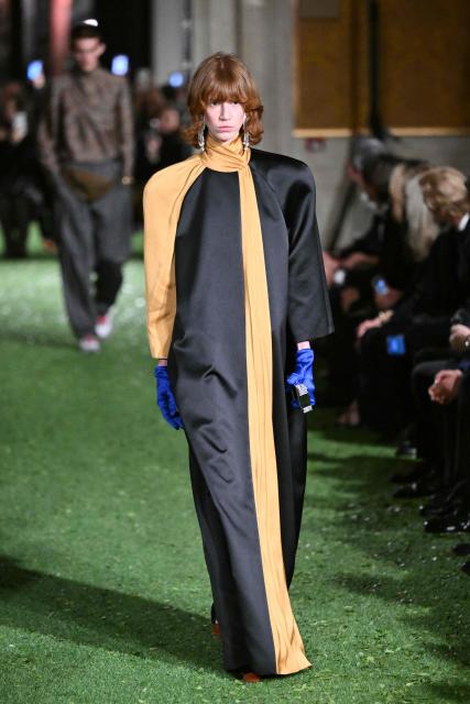 A model presents a creation by Italian fashion house Valentino during the show "Interferenze" Fall/Winter 2026-2027 collection at Palazzo Barberini in Rome on March 12, 2026. Italian fashion house Valentino returns to its roots with a catwalk show designed by creative director Alessandro Michele in one of Rome's most spectacular venues, two months after the death of founder Valentino Garavani. (Photo by Alberto PIZZOLI / AFP)