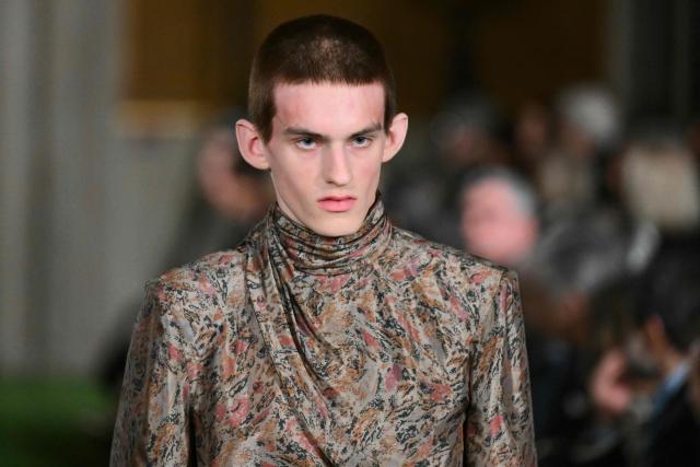 A model presents a creation by Italian fashion house Valentino during the show "Interferenze" Fall/Winter 2026-2027 collection at Palazzo Barberini in Rome on March 12, 2026. Italian fashion house Valentino returns to its roots with a catwalk show designed by creative director Alessandro Michele in one of Rome's most spectacular venues, two months after the death of founder Valentino Garavani. (Photo by Alberto PIZZOLI / AFP)