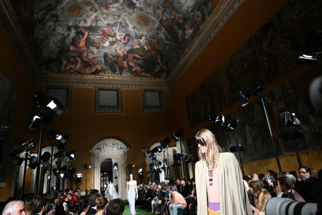 A model presents a creation by Italian fashion house Valentino during the show "Interferenze" Fall/Winter 2026-2027 collection at Palazzo Barberini in Rome on March 12, 2026. Italian fashion house Valentino returns to its roots with a catwalk show designed by creative director Alessandro Michele in one of Rome's most spectacular venues, two months after the death of founder Valentino Garavani. (Photo by Alberto PIZZOLI / AFP)