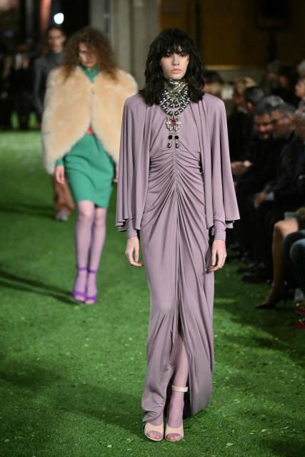 A model presents a creation by Italian fashion house Valentino during the show "Interferenze" Fall/Winter 2026-2027 collection at Palazzo Barberini in Rome on March 12, 2026. Italian fashion house Valentino returns to its roots with a catwalk show designed by creative director Alessandro Michele in one of Rome's most spectacular venues, two months after the death of founder Valentino Garavani. (Photo by Alberto PIZZOLI / AFP)