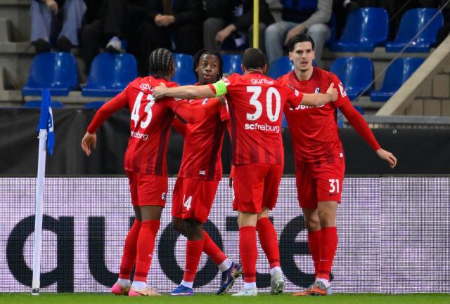 Freiburg's Swiss midfielder #44 Johan Manzambi celebrates after scoring a goal during the UEFA Europa League last 16 first leg football match between Krc Genk and Sc Freiburg at the Fenix Stadium in Genk on March 12, 2026. (Photo by JOHN THYS / AFP)