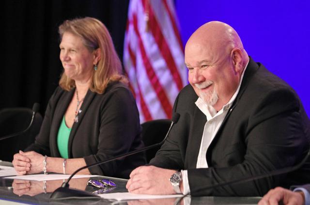 Lori Glaze, acting associate administrator, Exploration Systems Development Mission Directorate looks on as John Honeycutt, the Artemis II Mission Management Team chair smiles before answering a question about the flight readiness review of the Artemis II rocket components at the Kennedy Space Center in Cape Canaveral, Florida, on March 12, 2026. NASA rolled the massive Space Launch System rocket and Orion spacecraft back to the Vehicle Assembly Building from Launch Pad 39B on February 25 to troublshoot problems encountered during a wet dress rehearsal. NASA engineers and technicians will effect repairs and replace numerous flight batteries prior to sending four astronauts to the moon for the first time in more than 50 years. Artemis II is scheduled to launch in April. (Photo by Gregg Newton / AFP)
