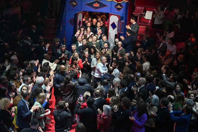 Socialistes et Apparentes' MP and Paris' mayoral candidate Emmanuel Gregoire (C) greets supporters as he arrives for a campaign meeting at the Cirque d'Hiver in Paris on March 12, 2026, ahead of France's municipal elections. French voters are scheduled to head to the polls for municipal elections on March 15 and March 22, 2026. (Photo by Martin LELIEVRE / AFP)