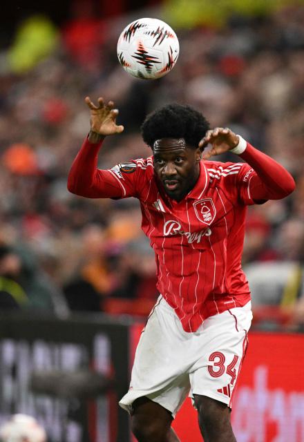 Nottingham Forest's Nigerian defender #34 Ola Aina takes a throw-in during the UEFA Europa League round of 16, first leg football match between Nottingham Forest and FC Midtjylland at The City Ground in Nottingham, central England, on March 12, 2026. (Photo by Oli SCARFF / AFP)