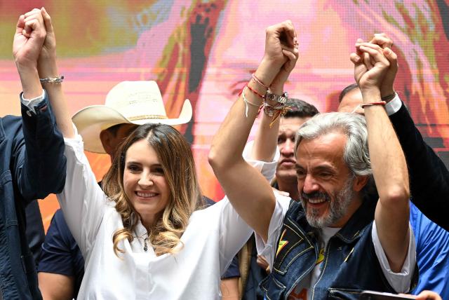 Colombia's presidential candidate for the conservative Democratic Centre party, Paloma Valencia (L), presents her running mate Juan Daniel Oviedo (R) in Bogota on March 12, 2026. Colombia will hold presidential elections on May 31st. (Photo by Raul ARBOLEDA / AFP)