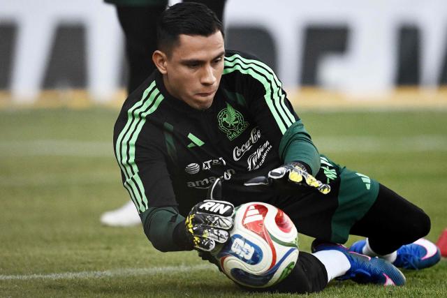 (FILES) Mexico's goalkeeper Luis Angel Malagon catches the ball during a training session at La Corregidora stadium in Santiago de Queretaro, Queretaro State, Mexico, on February 24, 2026. Mexican goalkeeper Luis Angel Malagon has been ruled out of the 2026 World Cup after the surgery he underwent on March 12, 2026, for a ruptured Achilles tendon will require an estimated recovery period of six to eight months. (Photo by Carl de Souza / AFP)
