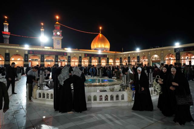 Muslim Shia faithful, including Iranian visitors and others, participate in the ritual of Itikaf, or spiritual retreat, at the Kufa Mosque, taking advantage of the days and nights of Laylat al-Qadr, or the Night of Destiny, one of the holiest nights during the holy fasting month of Ramadan, to pray in the holy city of Kufa, south of the Iraqi capital Baghdad on March 12, 2026. (Photo by Qassem al-KAABI / AFP)