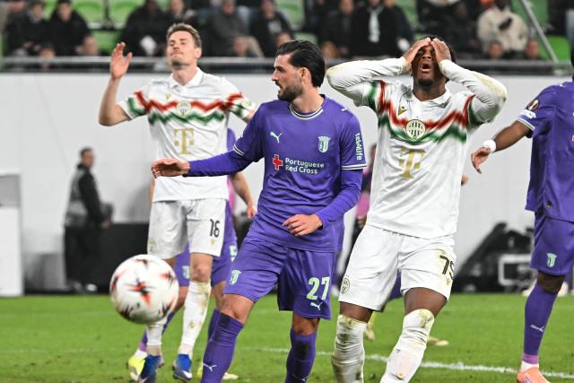Ferencvaros' French midfielder #75 Lenny Joseph reacts after missing a chance during the UEFA Europa League - Last 16 - first leg football match Ferencvaros v Sporting Braga in Budapest, Hungary, on March 12, 2026. (Photo by Attila KISBENEDEK / AFP)