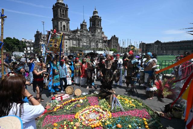 A group of indigenous people participate in a ceremony to celebrate the beginning of the Aztec year—known as "Xiuhpohualli"—which marks the start of the agricultural and solar cycle, in Mexico City on March 12, 2026. (Photo by Yuri CORTEZ / AFP)