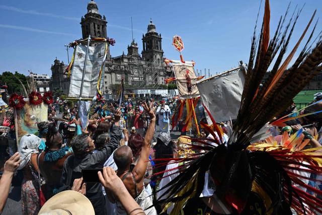 A group of indigenous people participate in a ceremony to celebrate the beginning of the Aztec year—known as "Xiuhpohualli"—which marks the start of the agricultural and solar cycle, in Mexico City on March 12, 2026. (Photo by Yuri CORTEZ / AFP)