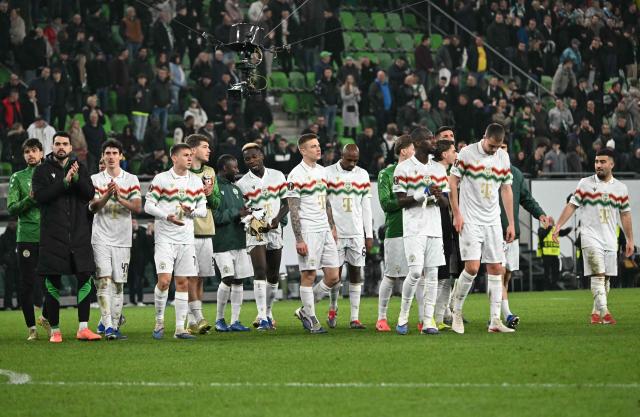 Ferencvaros' players celebrate at the end of the UEFA Europa League - Last 16 - first leg football match Ferencvaros v Sporting Braga in Budapest, Hungary, on March 12, 2026. (Photo by Attila KISBENEDEK / AFP)