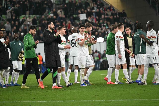 Ferencvaros' players celebrate at the end of the UEFA Europa League - Last 16 - first leg football match Ferencvaros v Sporting Braga in Budapest, Hungary, on March 12, 2026. (Photo by Attila KISBENEDEK / AFP)