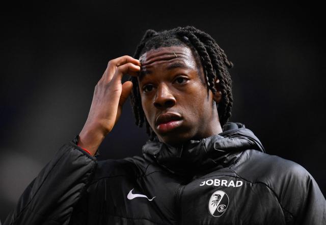 SC Freiburg's Swiss midfielder #44 Johan Manzambi reacts at the end of the UEFA Europa League last 16 first leg football match between KRC Genk and SC Freiburg at the Fenix Stadium in Genk on March 12, 2026. (Photo by JOHN THYS / AFP)