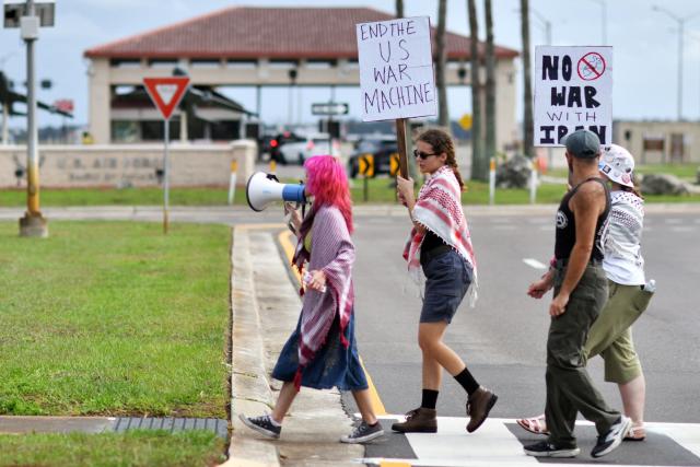 Demonstrators hold signs and shhout slogans during a protest to call for "an end to the imperialist violence" amid the ongoing war in Iran outside MacDill Air Force Base, where US Central Command is headquartered, in Tampa, Florida, on March 12, 2026. (Photo by Octavio JONES / AFP)