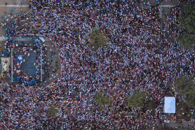 This aerial view shows Venezuelans living in Chile listening to Venezuelan opposition leader Maria Corina Machado at Almagro Square in Santiago on March 12, 2026. Machado travelled to Chile to attend Chile's President Jose Antonio Kast's inauguration. (Photo by Javier TORRES / AFP)