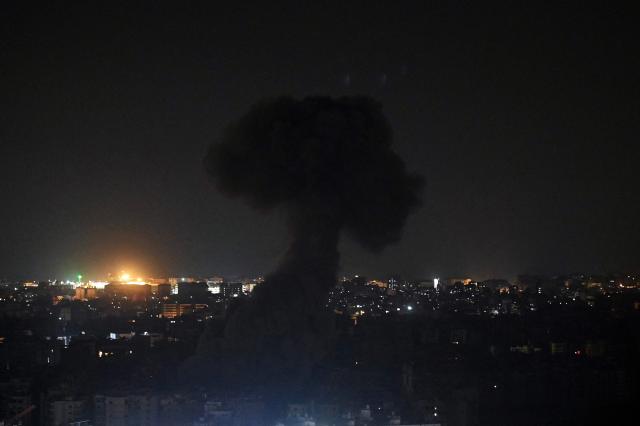 Smoke rises from the site of an Israeli airstrike that targeted an area in Beirut's southern suburbs, Lebanon, on March 13, 2026. Israel continued striking Beirut as it threatened to expand operations and seize territory in Lebanon if militant group Hezbollah did not stop its attacks. (Photo by FADEL itani / AFP) / 