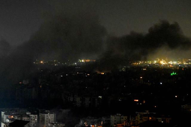 Smoke rises from the site of an Israeli airstrike that targeted an area in Beirut's southern suburbs, Lebanon, on March 13, 2026. Israel continued striking Beirut as it threatened to expand operations and seize territory in Lebanon if militant group Hezbollah did not stop its attacks. (Photo by FADEL itani / AFP) / 