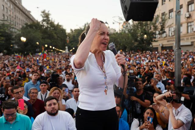 Venezuelan opposition leader Maria Corina Machado gestures as she speaks to members of the Venezuelan community during an encounter in Chile at Almagro Square in Santiago on March 12, 2026. Machado travelled to Chile to attend Chile's President Jose Antonio Kast's inauguration. (Photo by Raul BRAVO / AFP)