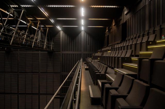 Stands in the interior of the Bio-Bio Theater, designed by Chilean architect Smiljan Radic, are pictured in Concepcion, Chile, on March 12, 2026. On March 12, the Pritzker Prize, the world's highest award in architecture, was awarded to Chilean Smiljan Radic Clarke, known especially for his use of natural materials, the Chicago-based organization announced. (Photo by Lukas Jara / AFP)