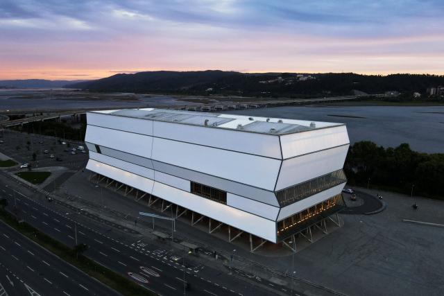 This aerial view shows the Bio-Bio Theater, designed by Chilean architect Smiljan Radic, in Concepcion, Chile, on March 12, 2026. On March 12, the Pritzker Prize, the world's highest award in architecture, was awarded to Chilean Smiljan Radic Clarke, known especially for his use of natural materials, the Chicago-based organization announced. (Photo by Lukas Jara / AFP)