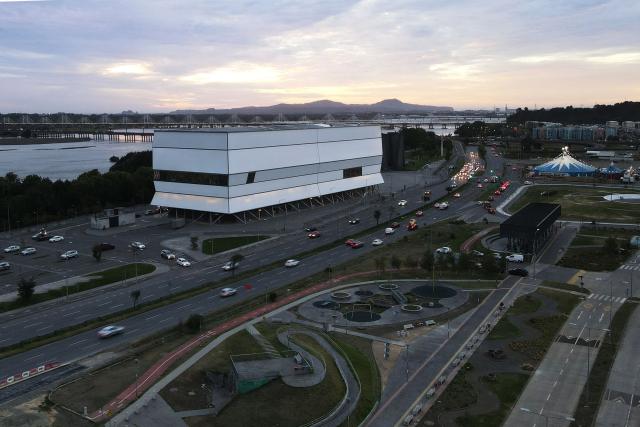 This aerial view shows the Bio-Bio Theater, designed by Chilean architect Smiljan Radic, in Concepcion, Chile, on March 12, 2026. On March 12, the Pritzker Prize, the world's highest award in architecture, was awarded to Chilean Smiljan Radic Clarke, known especially for his use of natural materials, the Chicago-based organization announced. (Photo by Lukas Jara / AFP)