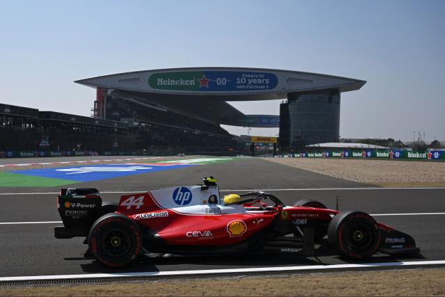 Ferrari's British driver Lewis Hamilton drives during a practice session ahead of the Formula One Chinese Grand Prix at the Shanghai International Circuit in Shanghai on March 13, 2026. (Photo by GREG BAKER / AFP)