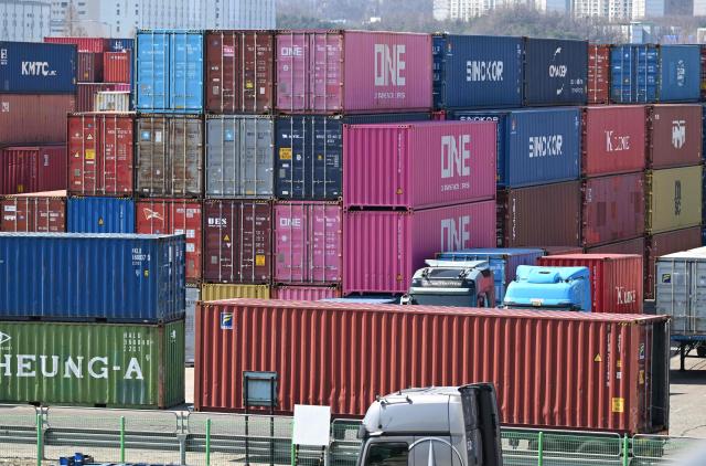 Cargo containers are seen at an Inland Container Depot (ICD) terminal in Uiwang on March 13, 2026. (Photo by Jung Yeon-je / AFP)