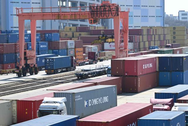 Cargo containers are seen at an Inland Container Depot (ICD) terminal in Uiwang on March 13, 2026. (Photo by Jung Yeon-je / AFP)
