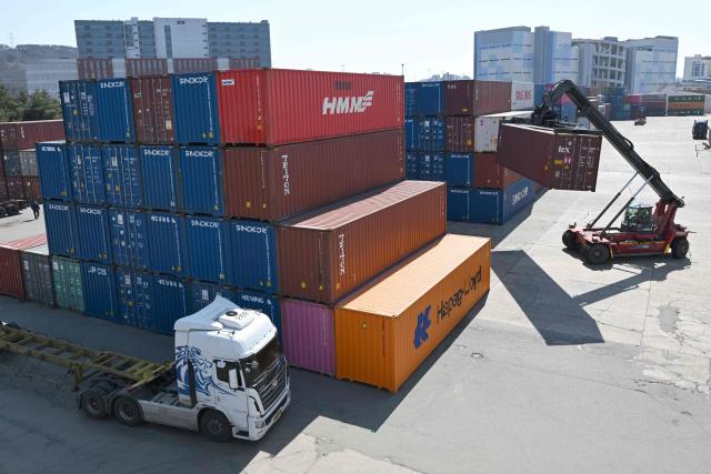 Cargo containers are seen at an Inland Container Depot (ICD) terminal in Uiwang on March 13, 2026. (Photo by Jung Yeon-je / AFP)