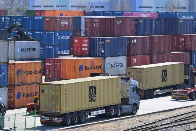 Cargo containers are seen at an Inland Container Depot (ICD) terminal in Uiwang on March 13, 2026. (Photo by Jung Yeon-je / AFP)