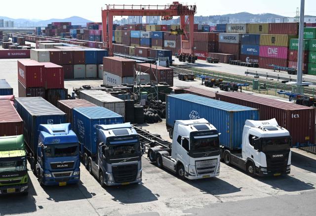 Cargo containers are seen at an Inland Container Depot (ICD) terminal in Uiwang on March 13, 2026. (Photo by Jung Yeon-je / AFP)