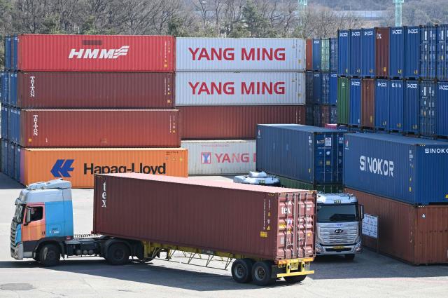 Cargo containers are seen at an Inland Container Depot (ICD) terminal in Uiwang on March 13, 2026. (Photo by Jung Yeon-je / AFP)