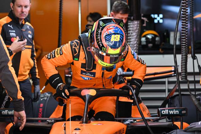McLaren's Australian driver Oscar Piastri getting into the car during a practice session ahead of the Formula One Chinese Grand Prix at the Shanghai International Circuit in Shanghai on March 13, 2026. (Photo by Hector RETAMAL / AFP)