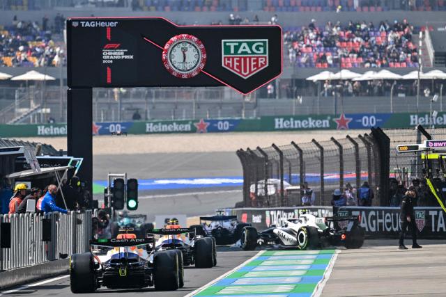Formula 1 cars are seen on the pit lane during a practice session ahead of the Formula One Chinese Grand Prix at the Shanghai International Circuit in Shanghai on March 13, 2026. (Photo by Hector RETAMAL / AFP)