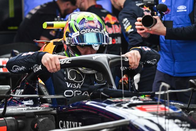 Red Bull Racing's French driver Isack Hadjar prepares before a practice session ahead of the Formula One Chinese Grand Prix at the Shanghai International Circuit in Shanghai on March 13, 2026. (Photo by Hector RETAMAL / AFP)