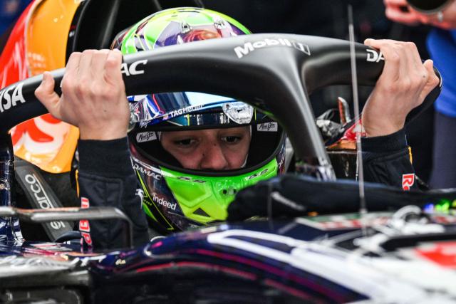 Red Bull Racing's French driver Isack Hadjar prepares before a practice session ahead of the Formula One Chinese Grand Prix at the Shanghai International Circuit in Shanghai on March 13, 2026. (Photo by Hector RETAMAL / AFP)