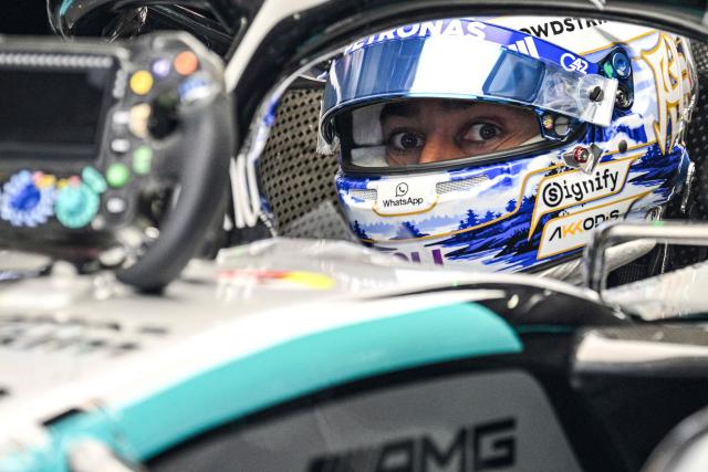 Mercedes’ British driver George Russell prepares before a practice session ahead of the Formula One Chinese Grand Prix at the Shanghai International Circuit in Shanghai on March 13, 2026. (Photo by Hector RETAMAL / AFP)