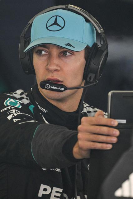Mercedes’ British driver George Russell prepares before a practice session ahead of the Formula One Chinese Grand Prix at the Shanghai International Circuit in Shanghai on March 13, 2026. (Photo by Hector RETAMAL / AFP)