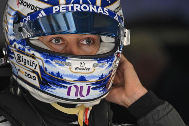 Mercedes’ British driver George Russell prepares before a practice session ahead of the Formula One Chinese Grand Prix at the Shanghai International Circuit in Shanghai on March 13, 2026. (Photo by Hector RETAMAL / AFP)