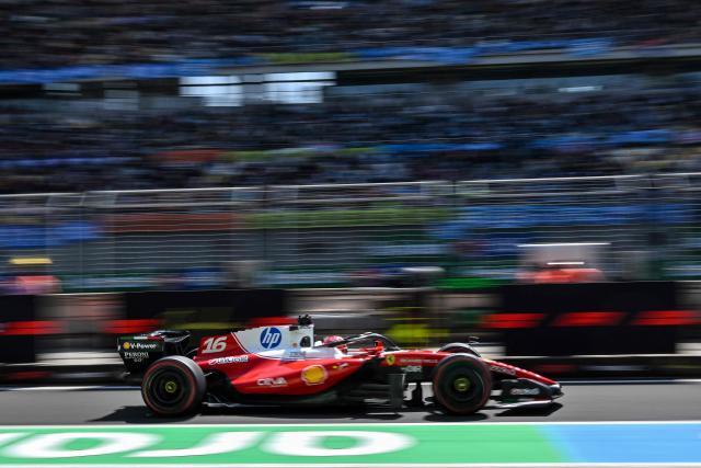 Ferrari's Monegasque driver Charles Leclerc arrives to the pit lane during a practice session ahead of the Formula One Chinese Grand Prix at the Shanghai International Circuit in Shanghai on March 13, 2026. (Photo by Hector RETAMAL / AFP)