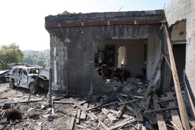 The destruction at the site of a rocket strike in Zarzir, northern Israel, is pictured on March 13, 2026. New waves of attacks struck Iran and Gulf nations on March 13 after Tehran renewed its threats on oil facilities, while France announced its first soldier killed during the Mideast war. The latest strikes on Iran hit over 200 targets in the past day, Israel's military said well into the second week of the US-Israeli campaign that has grown into a deadly regional fight causing economic chaos. (Photo by Odd ANDERSEN / AFP) / 