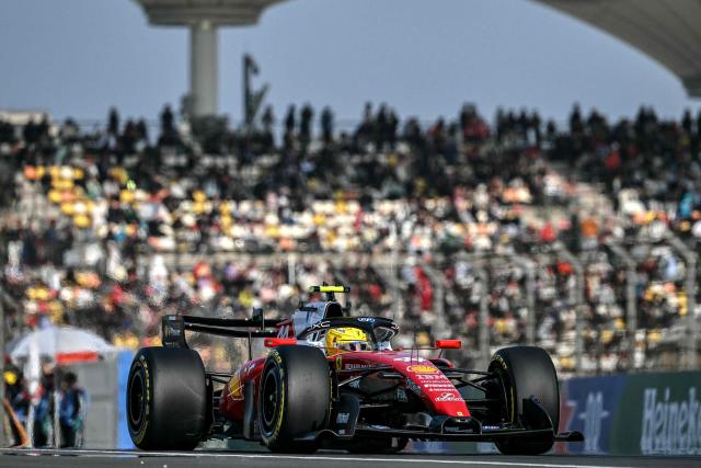 Ferrari's British driver Lewis Hamilton drives during the sprint qualifying session ahead of the Formula One Chinese Grand Prix at the Shanghai International Circuit in Shanghai on March 13, 2026. (Photo by Greg Baker / AFP)