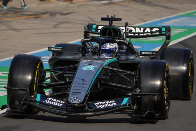 Mercedes' British driver George Russell drives in the pit lane during the sprint qualifying session ahead of the Formula One Chinese Grand Prix at the Shanghai International Circuit in Shanghai on March 13, 2026. (Photo by Andy WONG / POOL / AFP)